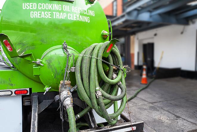 routine grease trap pumping by licensed technician in Bowling Green